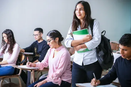Student in class room with books